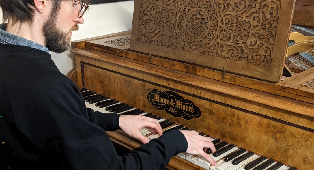 Me playing a slightly ancient grand piano. It's great if you don't play the middle E!